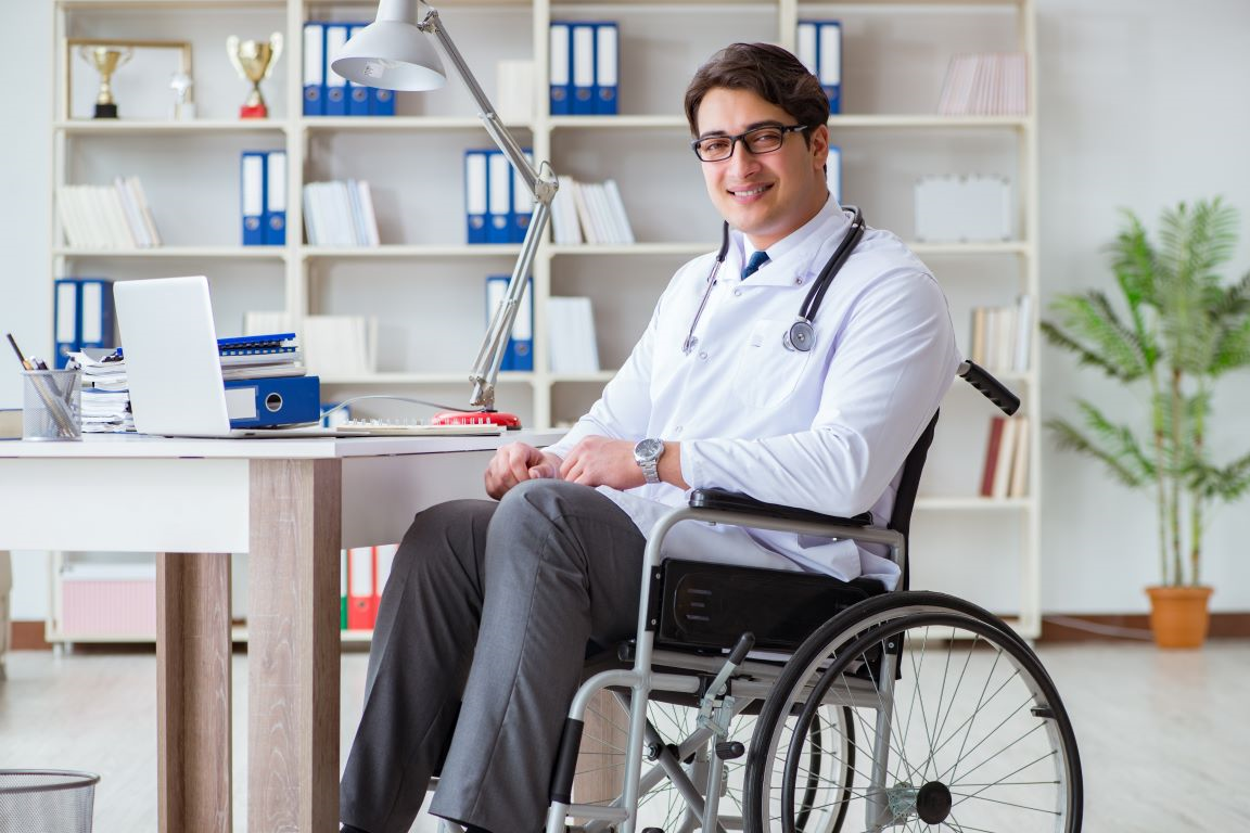 Physician using a wheelchair in a laboratory